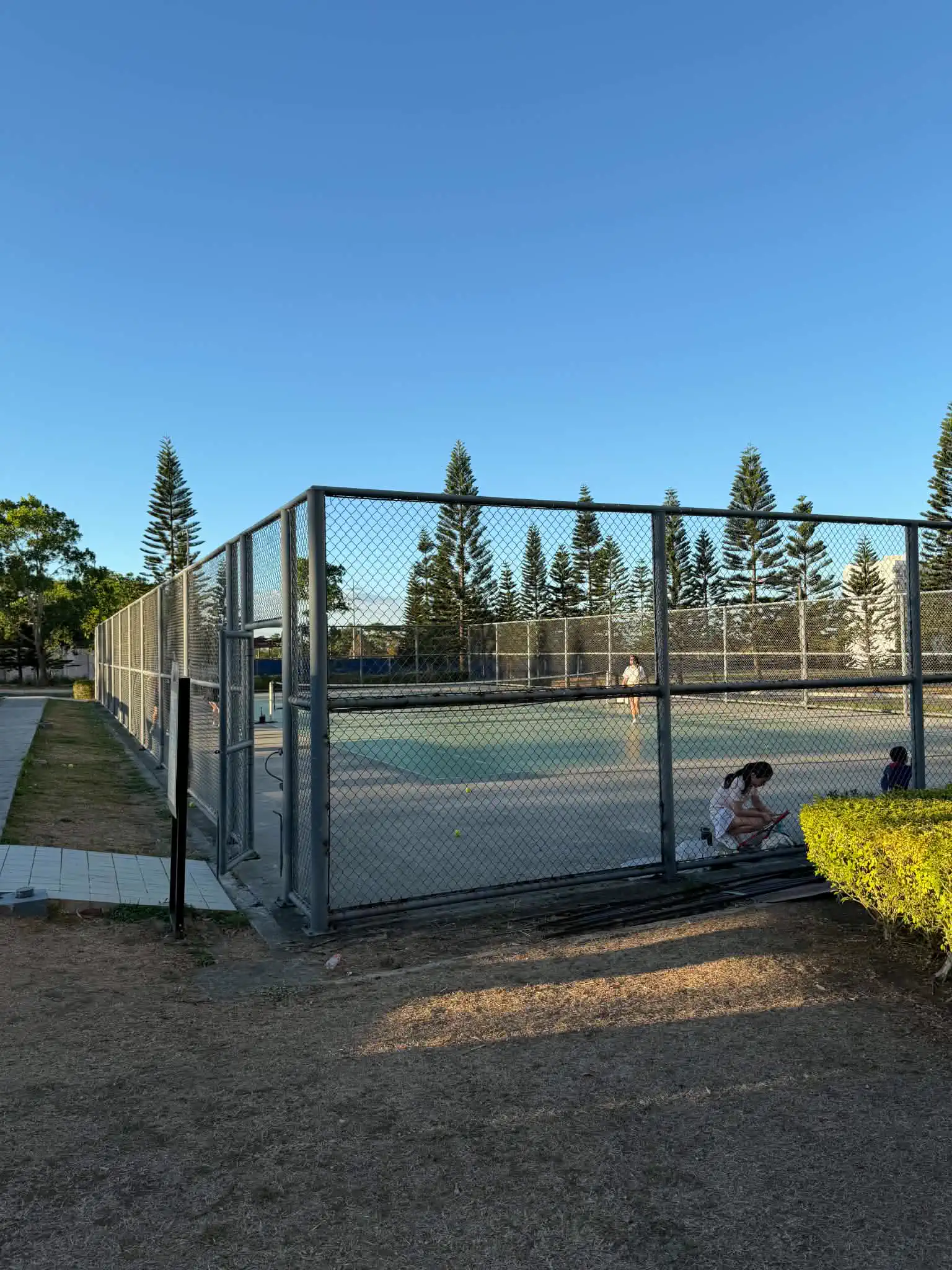Outdoor tennis court at Wind Residences