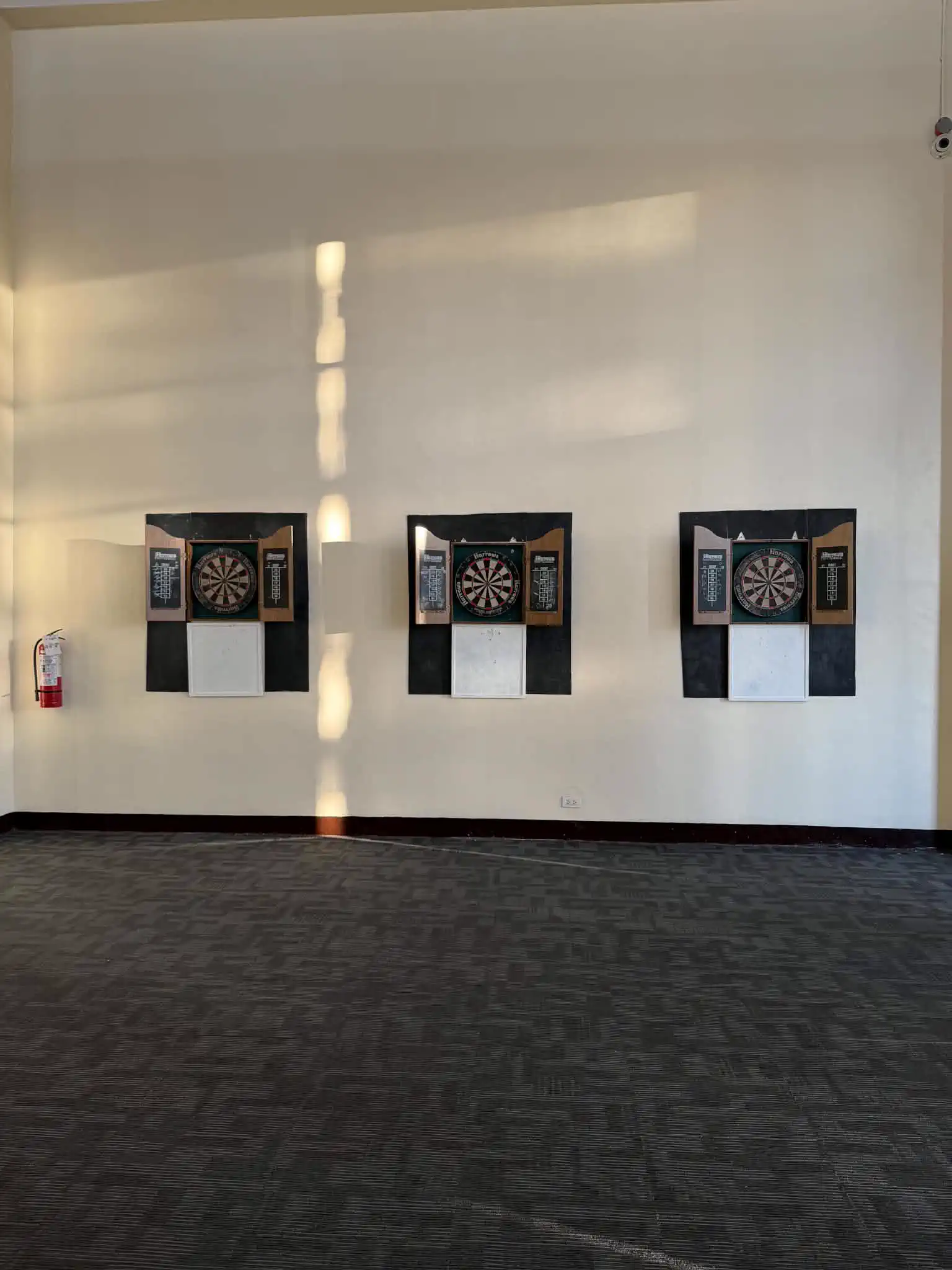 Dartboards inside the recreation hall at Wind Residences